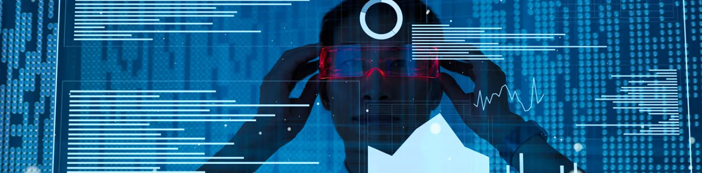 Asian man viewing data using virtual reality glasses
