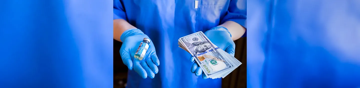 A medical professional holding a Covid-19 vaccine in one hand and 100 dollar bills in the other