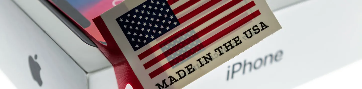 An iPhone x box on a light box early in the day with a made in the USA band.