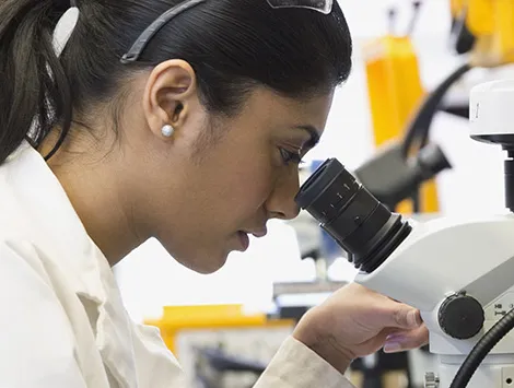 Woman conducting research in a lab