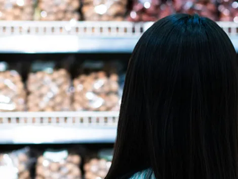 Asian young woman shopping in supermarket 