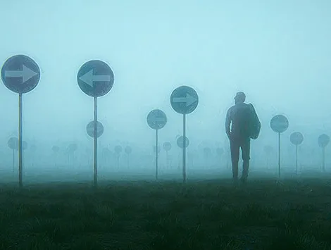 An illustration of a man in a foggy meadow with arrow signs pointing in multiple directions