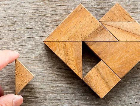 A puzzle of wooden blocks that creates the shape of a heart