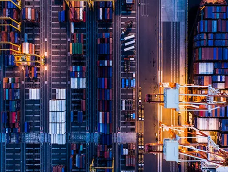 Overhead view of a shipping yard at night