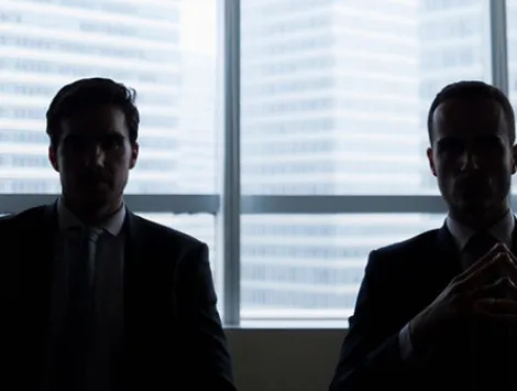 Silhouette row of businessmen sitting in meeting room