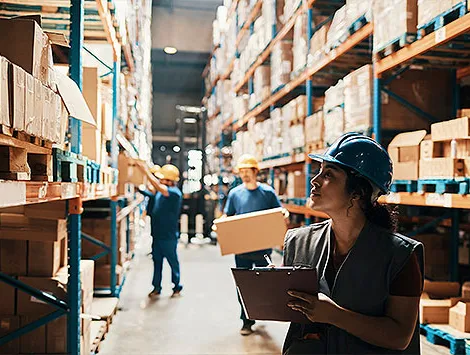 Close up of a group of workers working in a warehouse